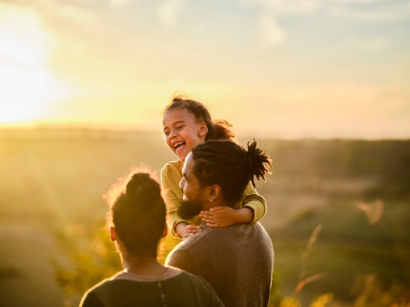 Family enjoying a sunset over rolling hills near Humber Station in Bolton, Caledon